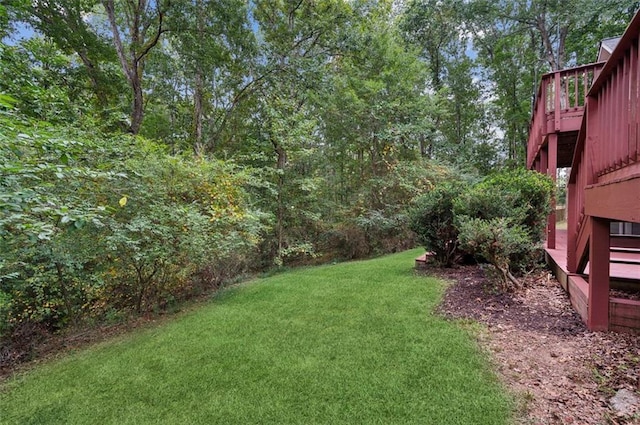 view of yard with a wooden deck