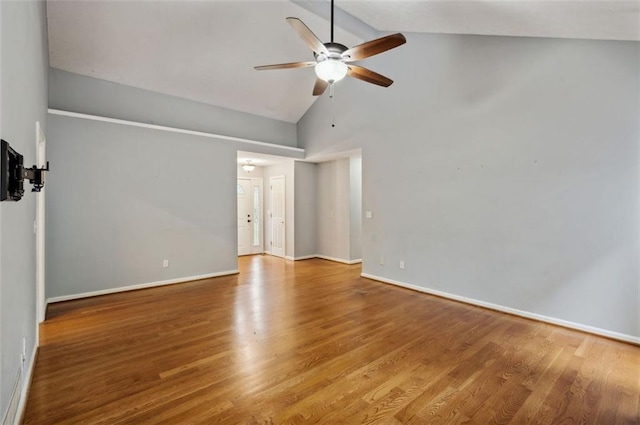 spare room featuring ceiling fan, hardwood / wood-style flooring, and high vaulted ceiling