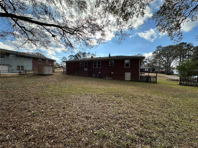 exterior space featuring a yard and fence