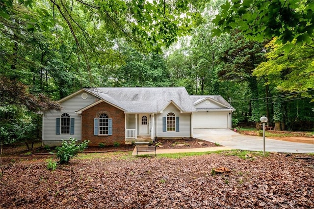 3105 The Trail Rd, Gainesville, GA 30501 - ranch-style house featuring driveway, an attached garage, and view of wooded area