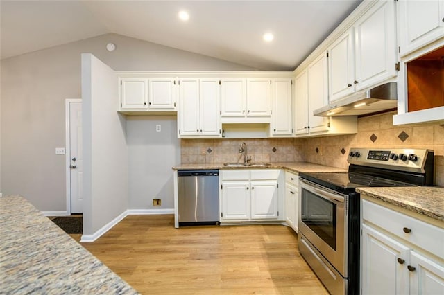 3105 The Trail Rd, Gainesville, GA 30501 - kitchen with appliances with stainless steel finishes, under cabinet range hood, open shelves, vaulted ceiling, and white cabinetry