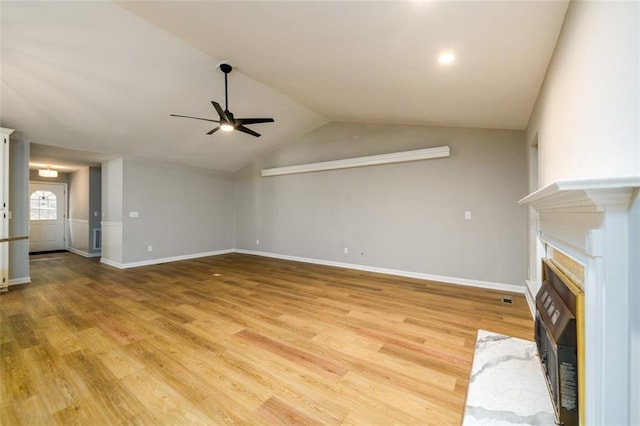 3105 The Trail Rd, Gainesville, GA 30501 - unfurnished living room with ceiling fan, a fireplace with flush hearth, light wood-style flooring, and lofted ceiling