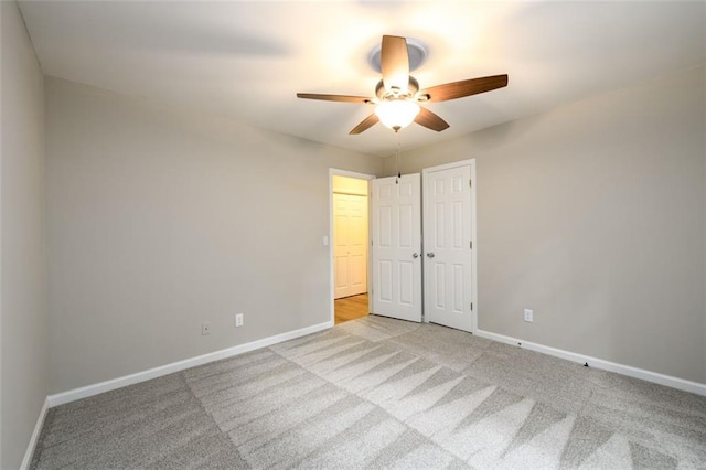 3105 The Trail Rd, Gainesville, GA 30501 - unfurnished bedroom featuring light colored carpet, ceiling fan, and a closet