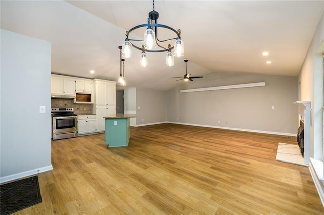3105 The Trail Rd, Gainesville, GA 30501 - kitchen featuring electric stove, vaulted ceiling, ceiling fan, a chandelier, and white cabinets