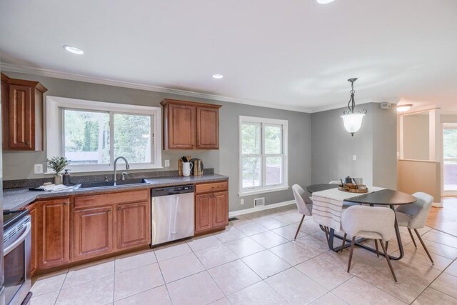 2279 Parkview Cir, College Park, GA 30337 - kitchen with stainless steel appliances, a sink, brown cabinetry, ornamental molding, and hanging light fixtures