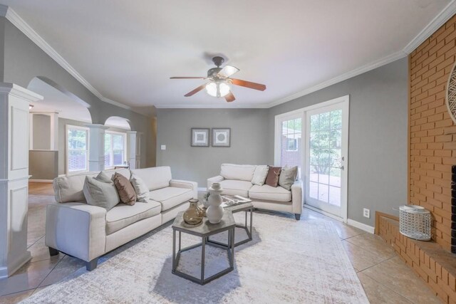 2279 Parkview Cir, College Park, GA 30337 - living room featuring ceiling fan, arched walkways, ornamental molding, ornate columns, and light tile patterned flooring