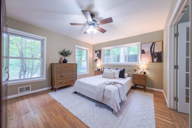 2279 Parkview Cir, College Park, GA 30337 - bedroom with baseboards, light wood-type flooring, and a ceiling fan