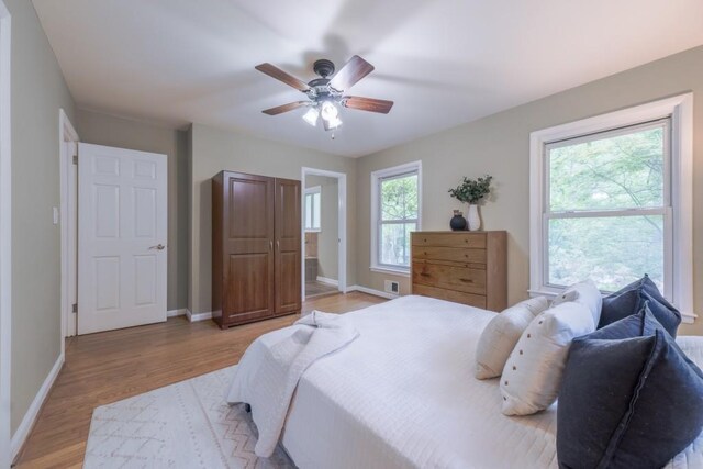 2279 Parkview Cir, College Park, GA 30337 - bedroom featuring light wood-type flooring, baseboards, and a ceiling fan