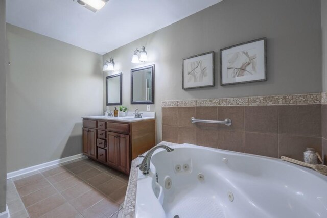 2279 Parkview Cir, College Park, GA 30337 - full bath featuring a tub with jets, tile patterned flooring, double vanity, and baseboards