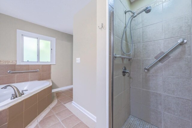 2279 Parkview Cir, College Park, GA 30337 - full bathroom with a stall shower, a garden tub, tile patterned flooring, and baseboards