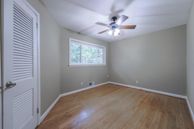 2279 Parkview Cir, College Park, GA 30337 - spare room featuring light wood-style flooring, ceiling fan, and baseboards