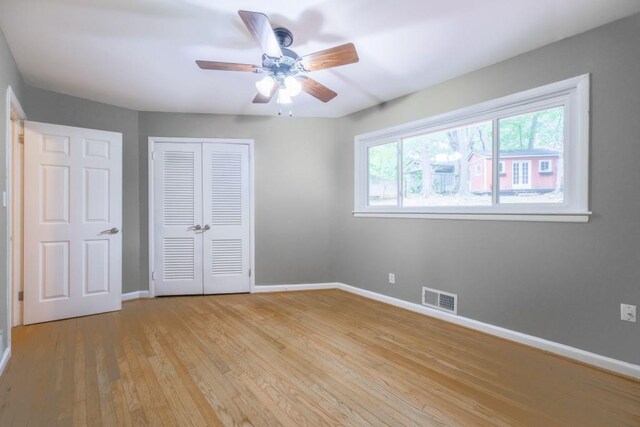 2279 Parkview Cir, College Park, GA 30337 - unfurnished bedroom with baseboards, light wood-type flooring, a closet, and ceiling fan