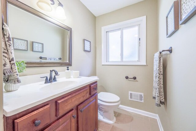 2279 Parkview Cir, College Park, GA 30337 - half bathroom featuring toilet, vanity, baseboards, and tile patterned floors