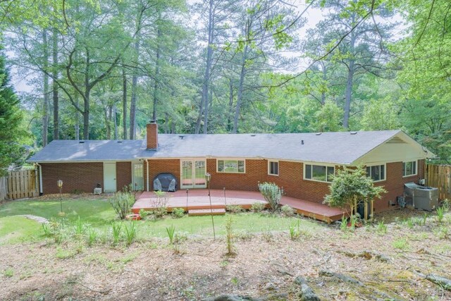 2279 Parkview Cir, College Park, GA 30337 - back of house with fence, a deck, a chimney, and french doors