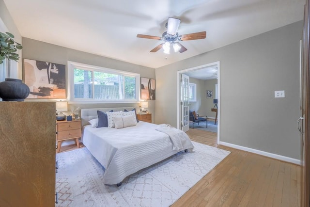 2279 Parkview Cir, College Park, GA 30337 - bedroom with light wood-style flooring, baseboards, and a ceiling fan