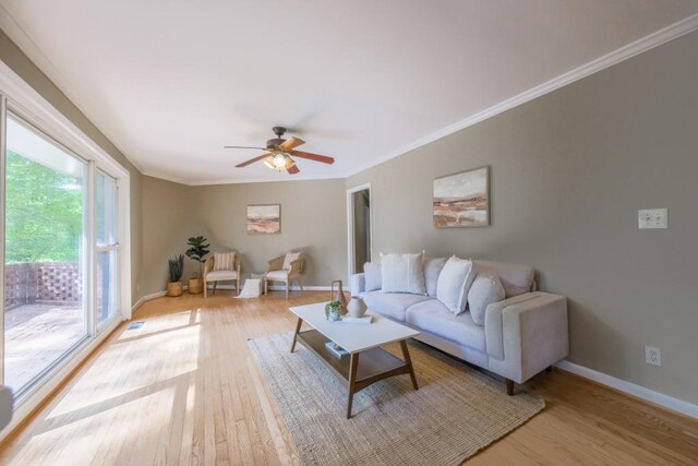 2279 Parkview Cir, College Park, GA 30337 - living room featuring wood finished floors, ornamental molding, baseboards, and ceiling fan
