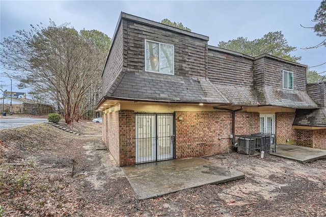 back of house with french doors, a patio, and cooling unit