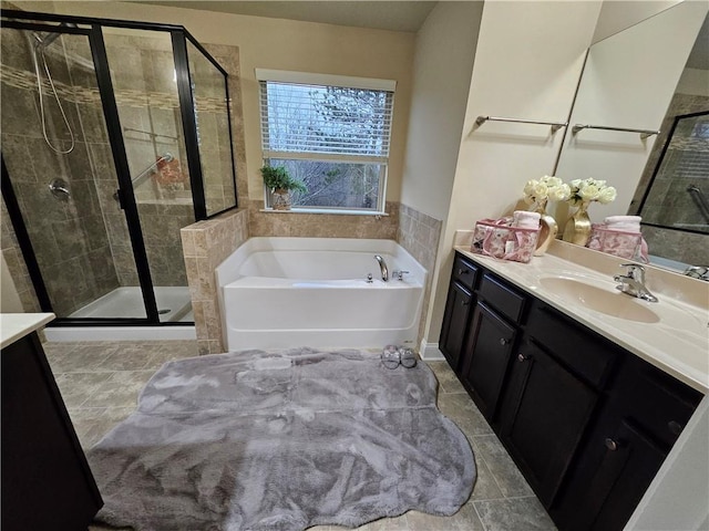 bathroom with vanity, tile patterned flooring, and plus walk in shower