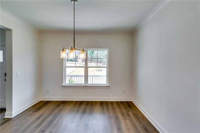 unfurnished dining area with baseboards, a notable chandelier, and dark wood-type flooring