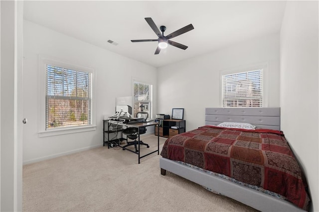 carpeted bedroom featuring ceiling fan