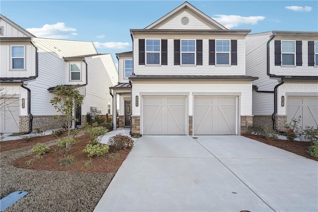 view of front of house with a garage, stone siding, and concrete driveway