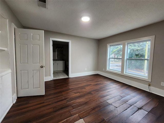 interior space featuring dark wood-type flooring and connected bathroom