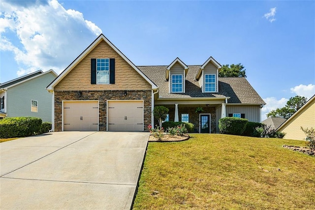 view of front of home featuring a garage and a front yard