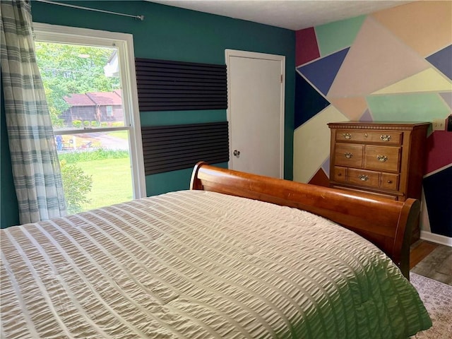 bedroom with wood finished floors