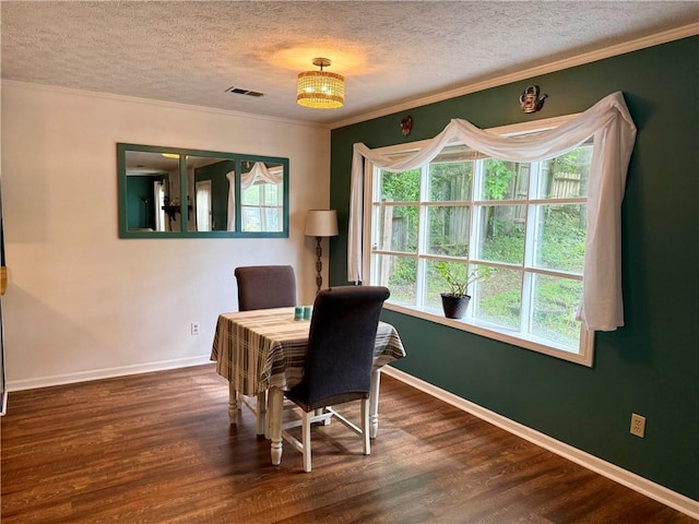 office with a textured ceiling, wood finished floors, baseboards, and crown molding