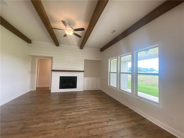 216 Montview Dr, Jefferson, GA 30549 - unfurnished living room with beam ceiling, ceiling fan, dark wood-style floors, a large fireplace, and baseboards