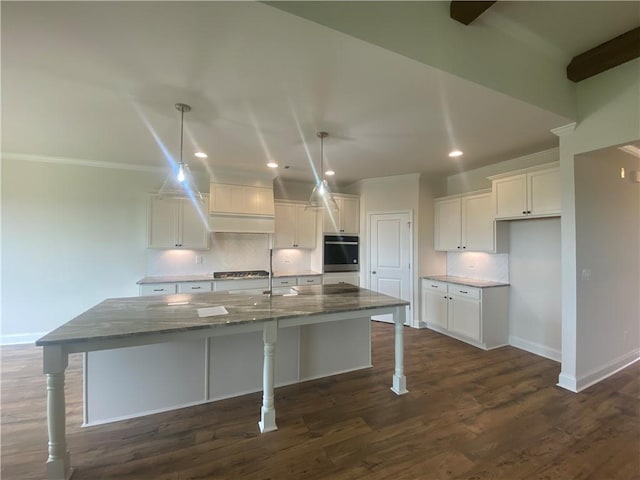 216 Montview Dr, Jefferson, GA 30549 - kitchen with white cabinets, tasteful backsplash, recessed lighting, baseboards, and dark stone counters