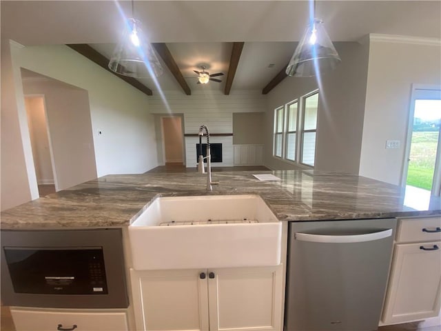 216 Montview Dr, Jefferson, GA 30549 - kitchen with appliances with stainless steel finishes, a sink, open floor plan, plenty of natural light, and beamed ceiling