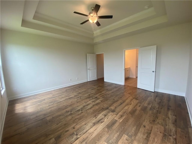 216 Montview Dr, Jefferson, GA 30549 - unfurnished bedroom featuring a raised ceiling, dark wood-type flooring, and baseboards