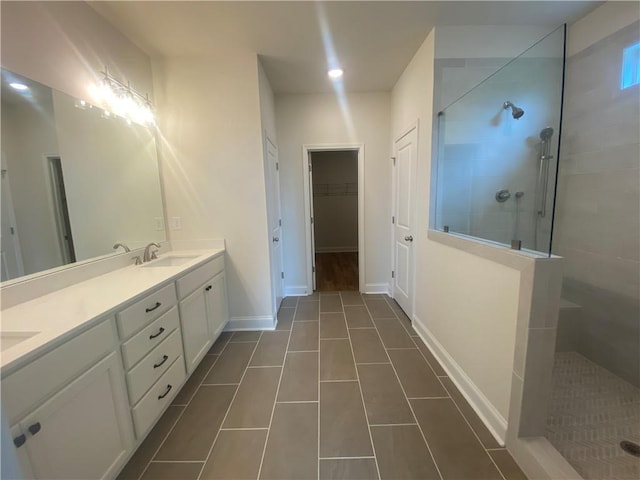 216 Montview Dr, Jefferson, GA 30549 - bathroom featuring walk in shower, double vanity, and tile patterned floors