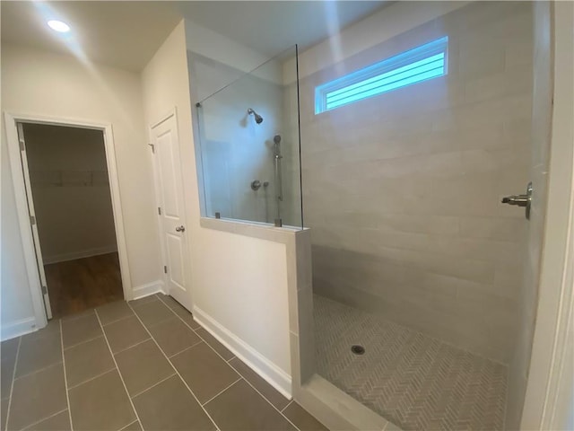 216 Montview Dr, Jefferson, GA 30549 - full bath featuring a walk in shower, tile patterned floors, and a walk in closet