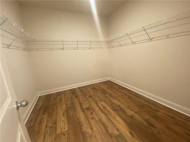 216 Montview Dr, Jefferson, GA 30549 - spacious closet featuring dark wood finished floors