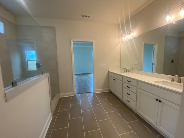 216 Montview Dr, Jefferson, GA 30549 - full bath with double vanity, walk in shower, tile patterned floors, and baseboards