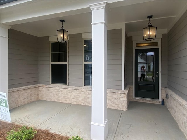 216 Montview Dr, Jefferson, GA 30549 - view of exterior entry with covered porch and brick siding