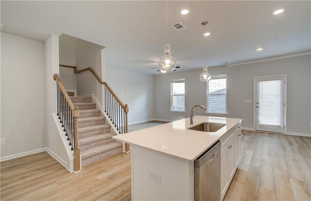 8147 Tiger Way, Riverdale, GA 30296 - kitchen featuring a sink, stainless steel dishwasher, light wood finished floors, white cabinetry, and recessed lighting
