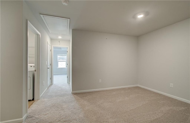 8147 Tiger Way, Riverdale, GA 30296 - unfurnished room with attic access, light colored carpet, washer / dryer, and baseboards