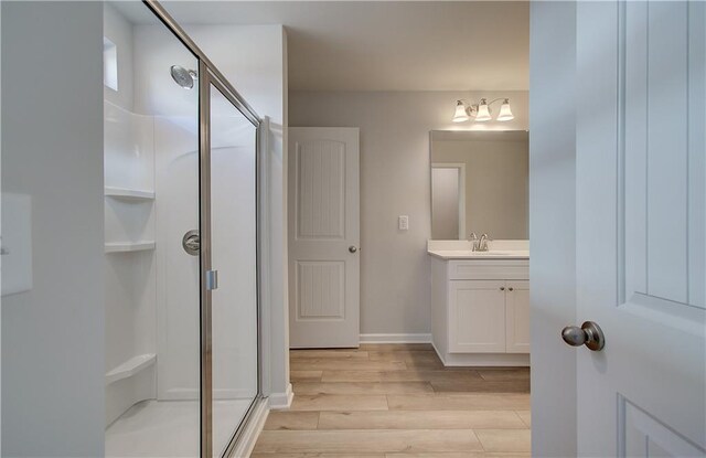 8147 Tiger Way, Riverdale, GA 30296 - full bath with a shower stall, wood finished floors, vanity, and baseboards