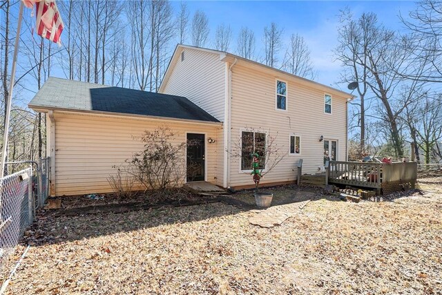 back of house featuring central AC unit