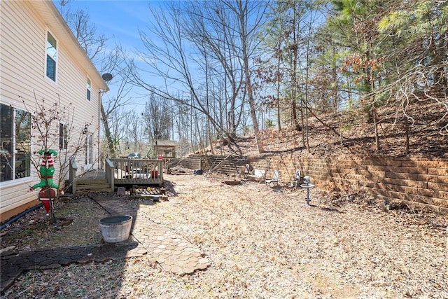 view of yard featuring a wooden deck