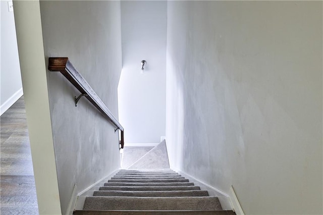 stairs featuring a high ceiling