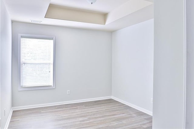 unfurnished room with light hardwood / wood-style floors