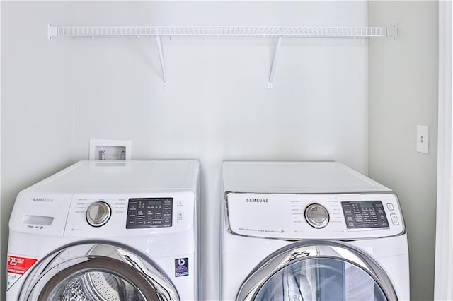 laundry room with washer and clothes dryer