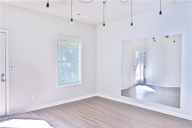 unfurnished room featuring hardwood / wood-style floors