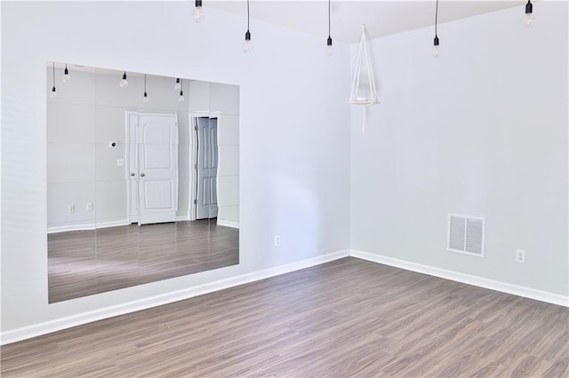 empty room featuring wood-type flooring