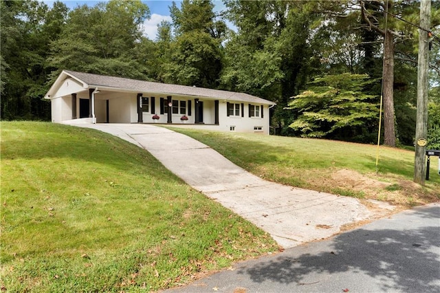 ranch-style house with a front yard, a carport, and driveway