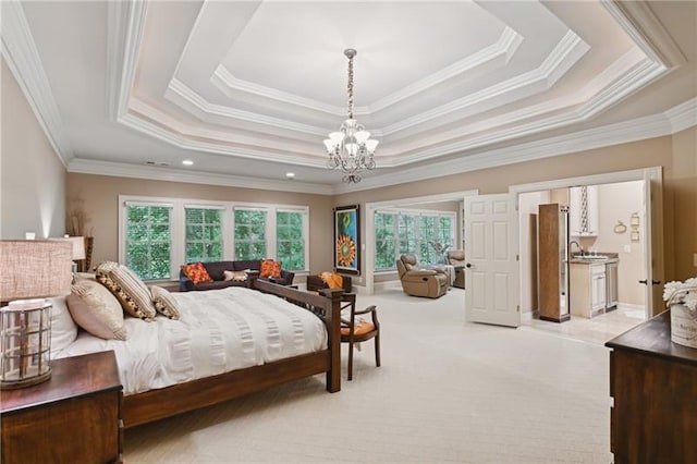 bedroom with a chandelier, crown molding, a tray ceiling, and multiple windows